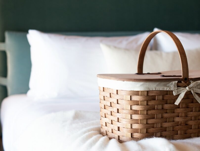 Daily breakfast basket on bed.